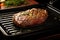 electric grill pan with a sizzling steak on it