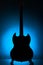 Electric guitar silhouette against blue background