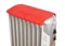 Electric heater covered by red towel