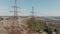 Electric high voltage pylon against sky. Aerial view from drone to power lines. Nature landscape, Sunny beautiful day