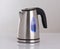 Electric kettle with blue lighting isolated