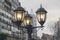 Electric light pole lantern on a city street with two bulb lamps