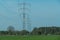 Electric line among green fields.