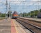 The electric locomotive is heading to the platform, the railway station