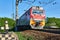 Electric locomotive moves on rails between two trap road with buffer stops