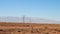 Electric masts and energetic line in the desert