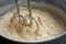 Electric mixer beats mass of batter