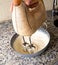 Electric mixer being used to prepare cheesecake ingredients