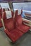 Electric multiple unit interior with red seat in first class coach