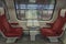 Electric multiple unit interior with red seat in first class coach