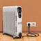Electric oil heater, oil-filled radiator in interior, 3D rendering