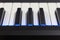 Electric piano detail with bright blue lights