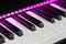Electric piano detail with pink lights