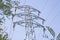 Electric pillar high voltage tower over blue sky