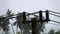 Electric pole with power supply lines under heavy rain