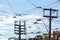 Electric power lines, on wooden poles, electricity supply, phone lines and streetcar cables, abiding by North American standards