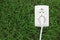 Electric power receptacle on a green grass