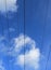 Electric powerlines against the blue sky. Geometry.