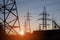 Electric powerlines on electric substation and distribution power. High voltage power lines, pylons at sunset