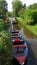 Electric punt boats at canal in romantic water village Giethoorn in the Netherlands