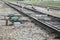 Electric remote rail switch. Iron rails on concrete sleepers. Perspective view