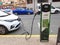 Electric Renault car connected to a public charging point in the street