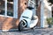 Electric Scooter on Cityscape Urban Background. Eco Alternative Transport In Downtown. 3d rendering.