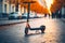 Electric scooter parked on an urban street in autumn