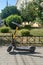 The electric scooter is on the street. Ecology. Transport Care for the environment