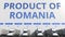 Electric semi-trailer trucks at warehouse loading dock with PRODUCT OF ROMANIA text. Romanian logistics related 3D