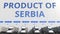 Electric semi-trailer trucks at warehouse loading dock with PRODUCT OF SERBIA text. Serbian logistics related 3D