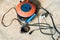 A Electric soldering iron blue handle and Roll of soldering wire w