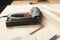 Electric stapler. On a wooden table. Wooden blocks in the workshop