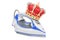 Electric steam iron with golden crown, 3D rendering