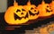 Electric string Halloween pumpkin lights on piano keyboard for Halloween party