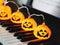 Electric string Halloween pumpkin lights on piano keyboard for Halloween party