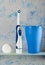 Electric toothbrush and hygiene items, on blue