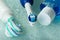 Electric toothbrush, paste and mouthwash, on wet glass shelf