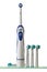Electric toothbrush with set of interchangeable tips on glass shelf