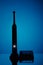 Electric toothbrush silhouette, blue background