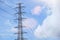 Electric tower on blue sky and clounds as a background