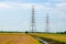 Electric towers in rice field