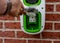 Electric vehicle domestic charging point installed outside of the house on new housing development as part of green energy program