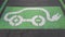 An electric vehicle parking space logo