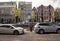 Electric vehicles plugged into charging points on a road in Amsterdam