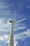 An electric wind turbine on a sky background. Windmill farms. Wind power. Renewable energy sources concept. Copy space.