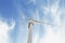 Electric windmill on a sky background. Innovative wind turbine manufacturing. Environment-friendly windmills concept.