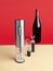 Electric wine opener, wine aerator and vacuum wine stopper..In the background there is a bottle of wine. Isolated