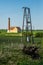 Electrical energy pole and old steam pump building