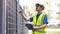 Electrical engineer working in Site. Electrical engineer man checking Power Distribution Cabinet